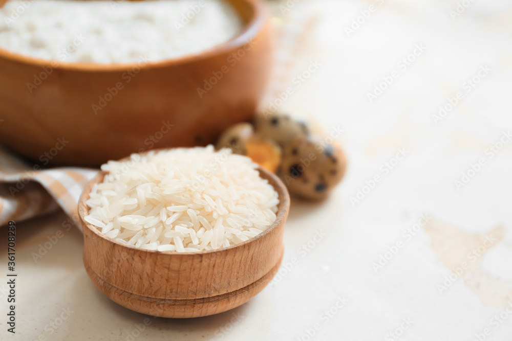 Bowl with rice on white background