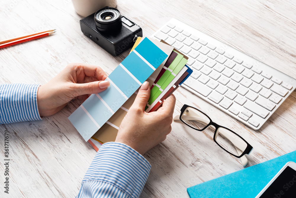 Interior designer holding color swatches