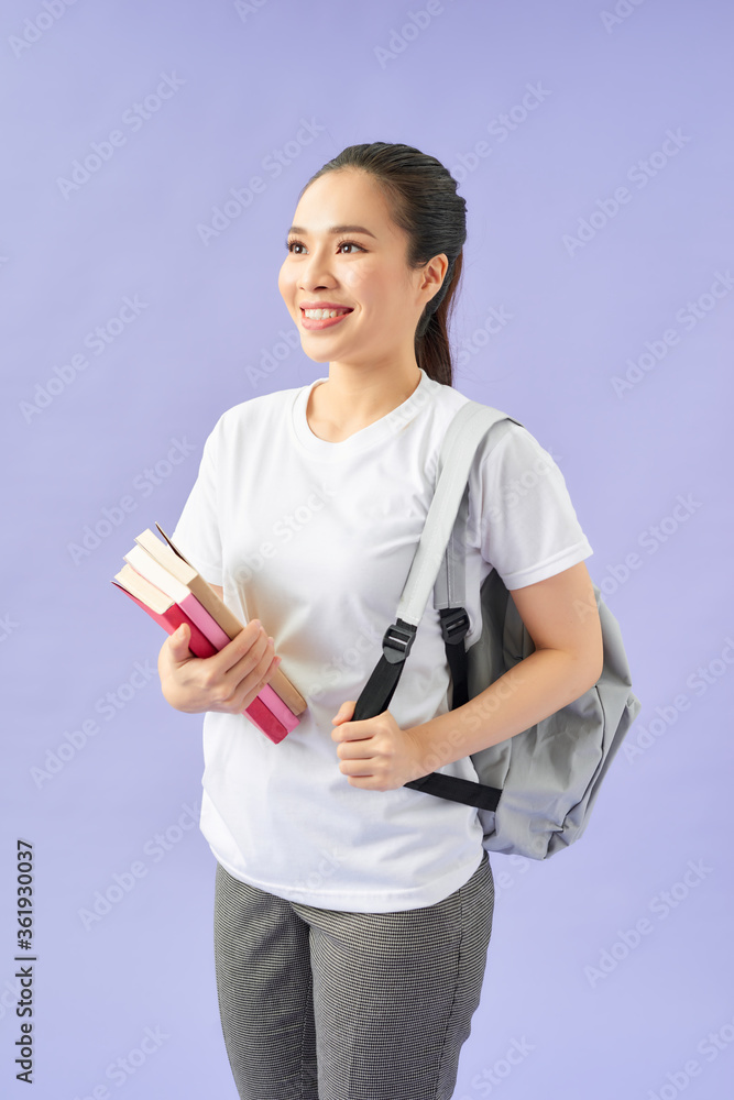 Student with backpack on purple background