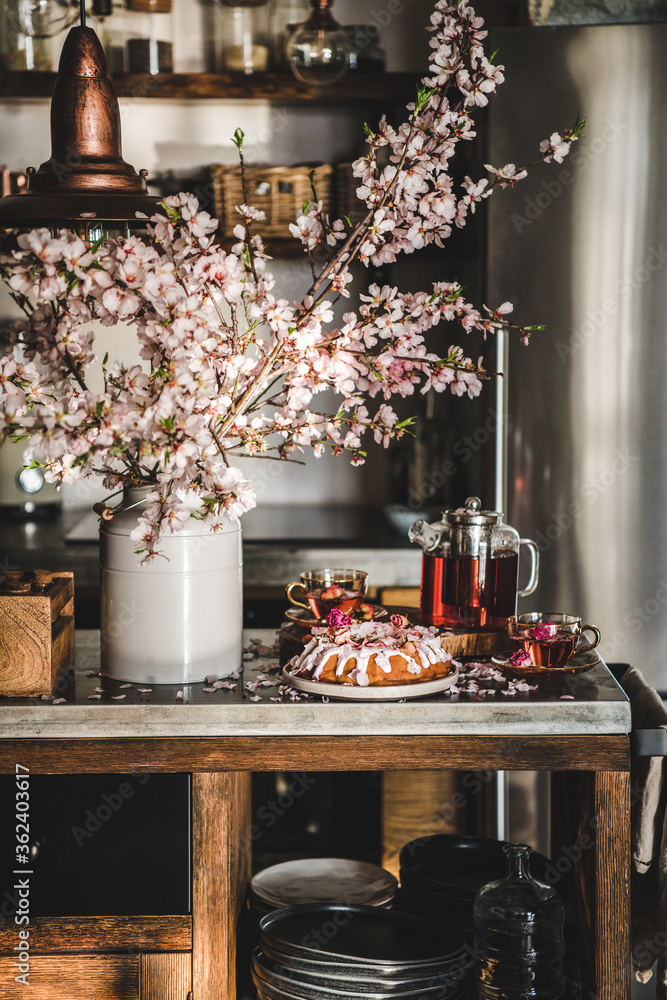 Spring or summer tea and cake setting. Rose and almond gluten-free bundt cake with rose flowers and 