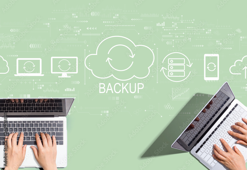 Backup concept with people working together with laptop computers