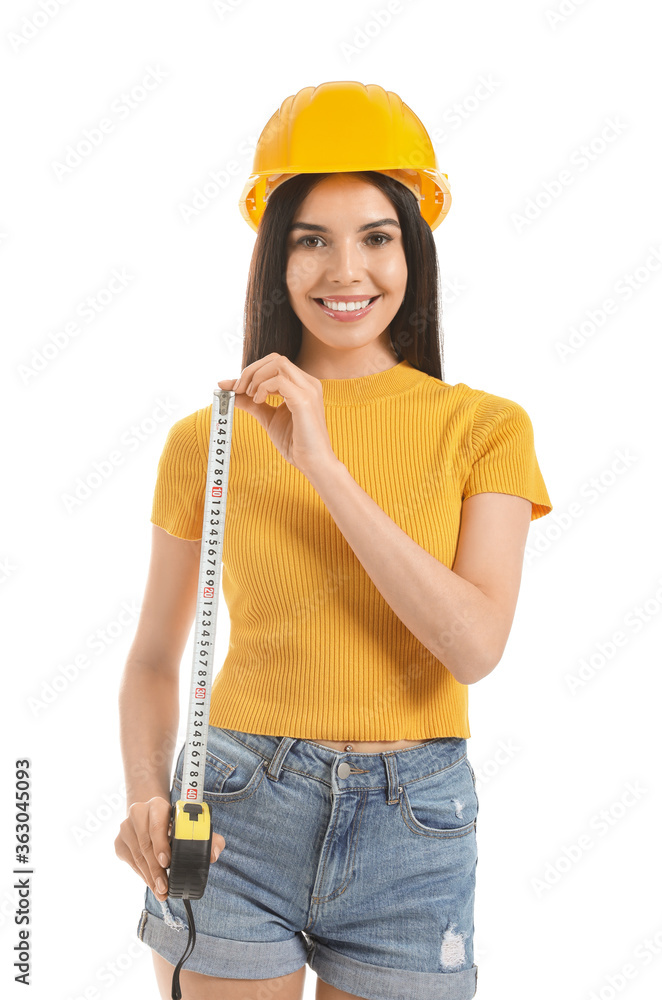 Young woman with measuring tape on white background