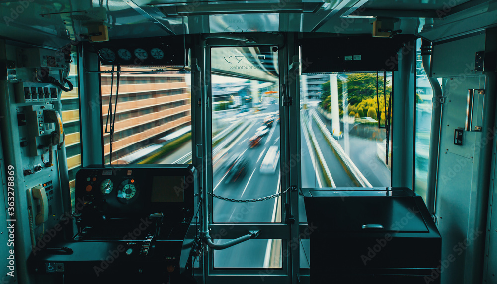 The suspened monorail system in Chiba, Japan, motion blurred view from inside the