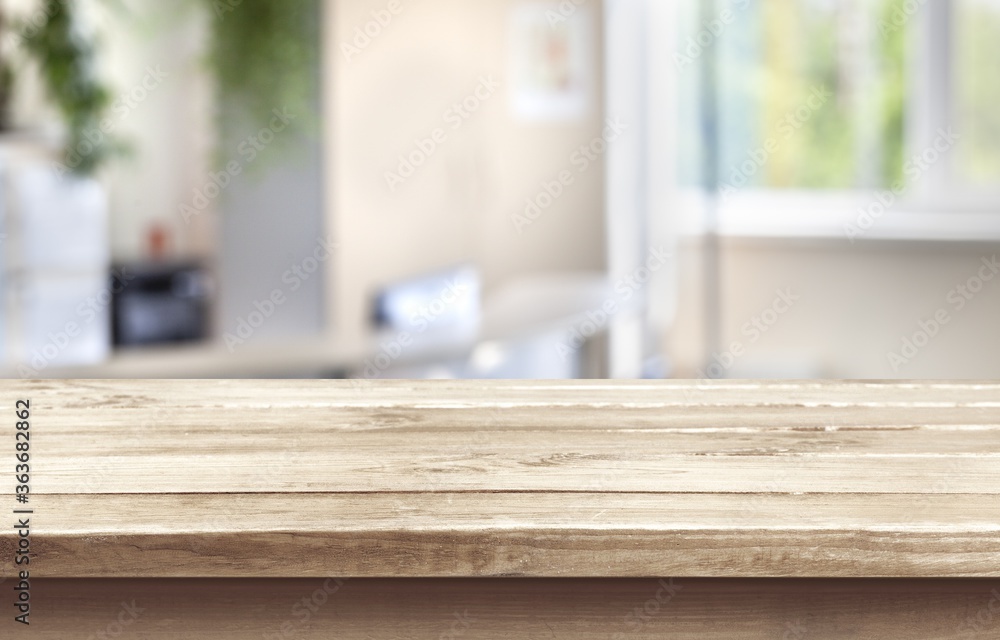 Wooden empty table top on blur background