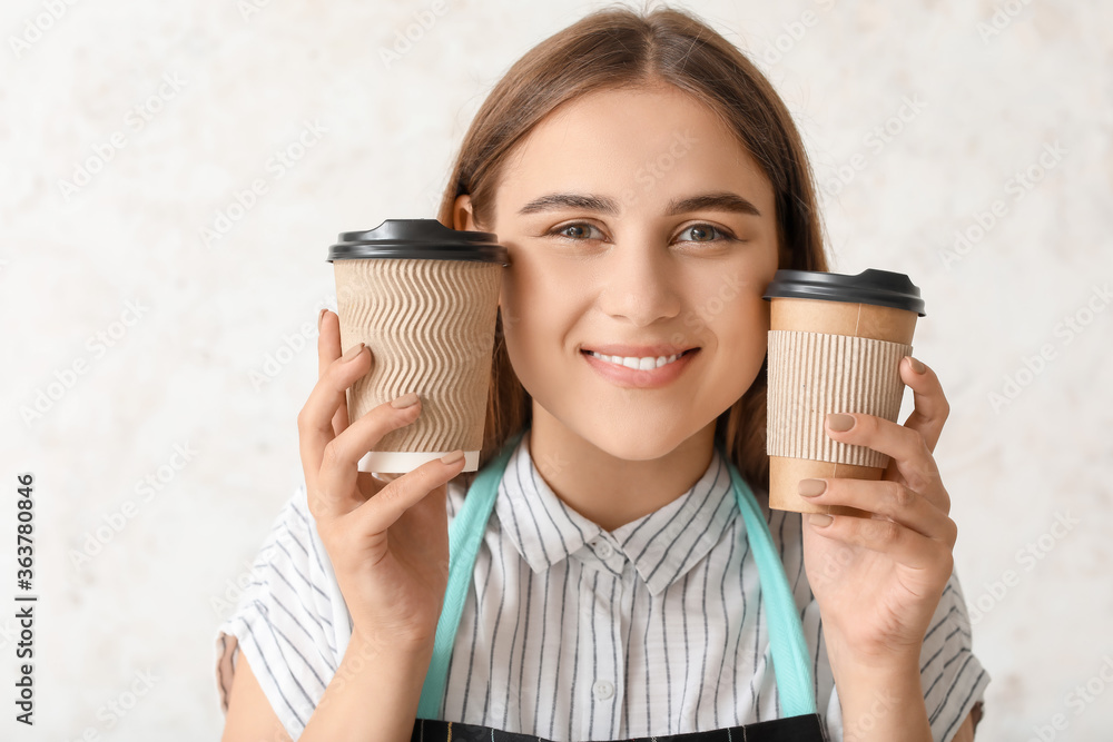 Female barista on light background