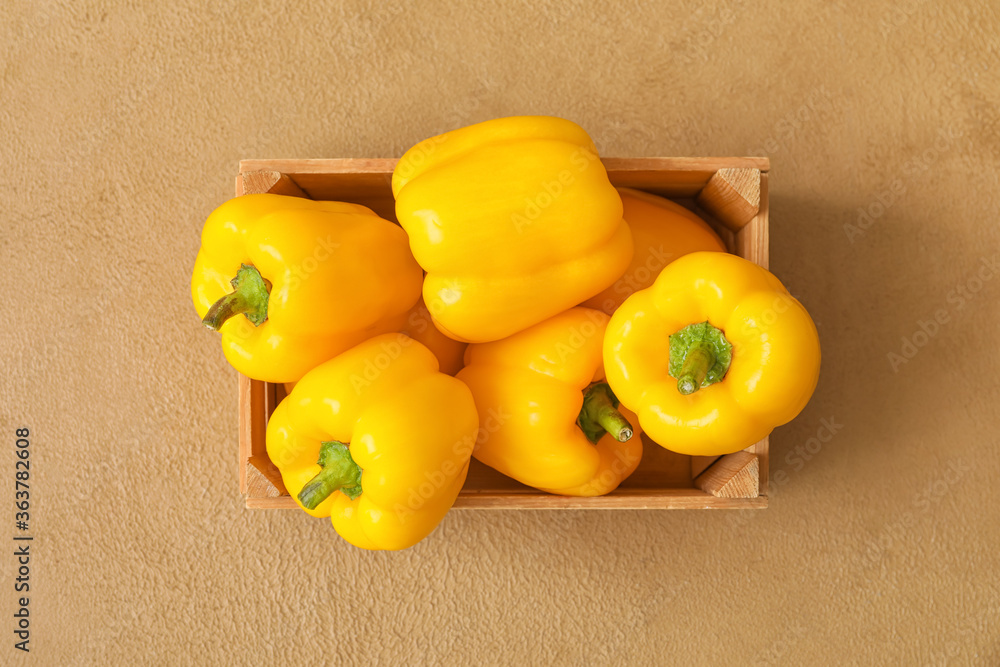 Yellow bell pepper in box on table