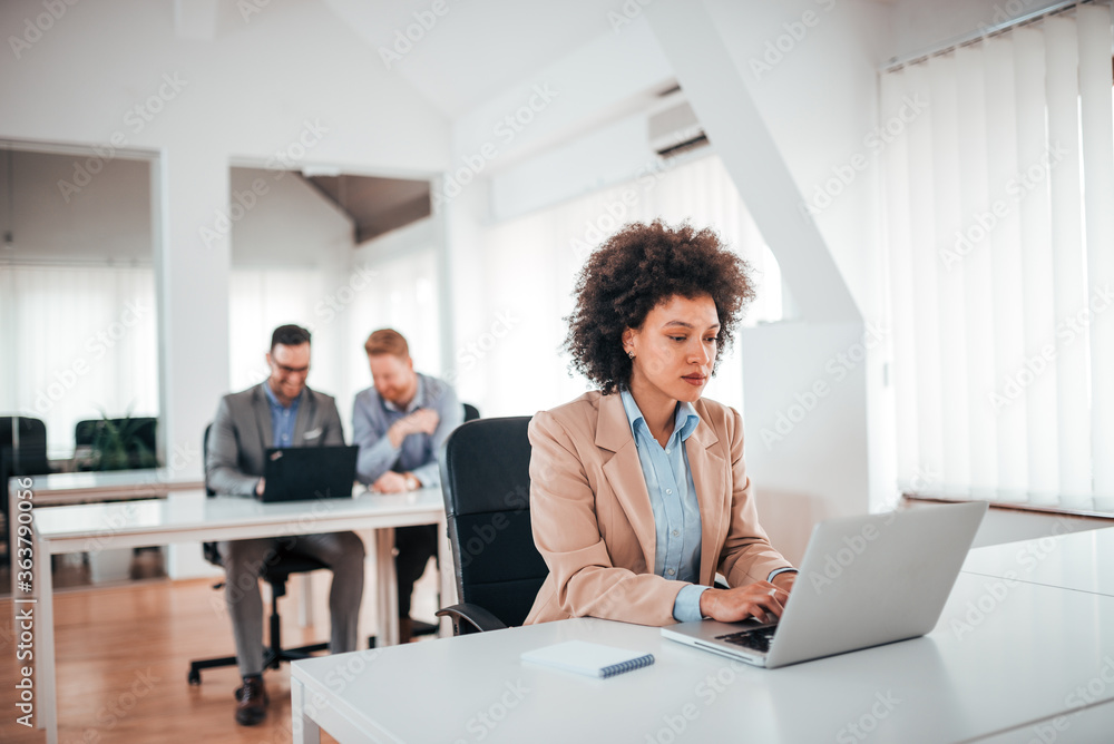 Caucasian business woman working on project at workplace.