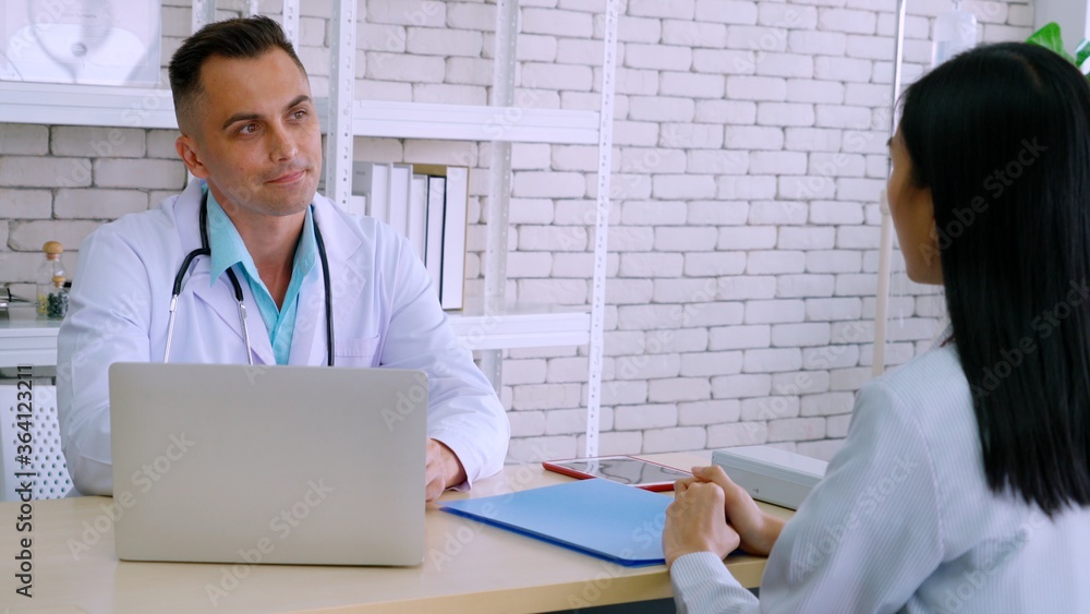 Doctor in professional uniform examining patient at hospital or medical clinic. Health care , medica