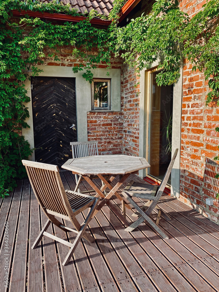 terrace with wooden table and chairs