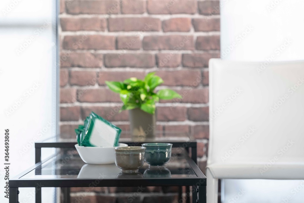 Tea cups and tea bags placed on the table in the living room