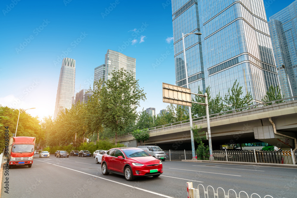 The citys tall buildings and high-speed cars, the urban landscape of Beijing, China.