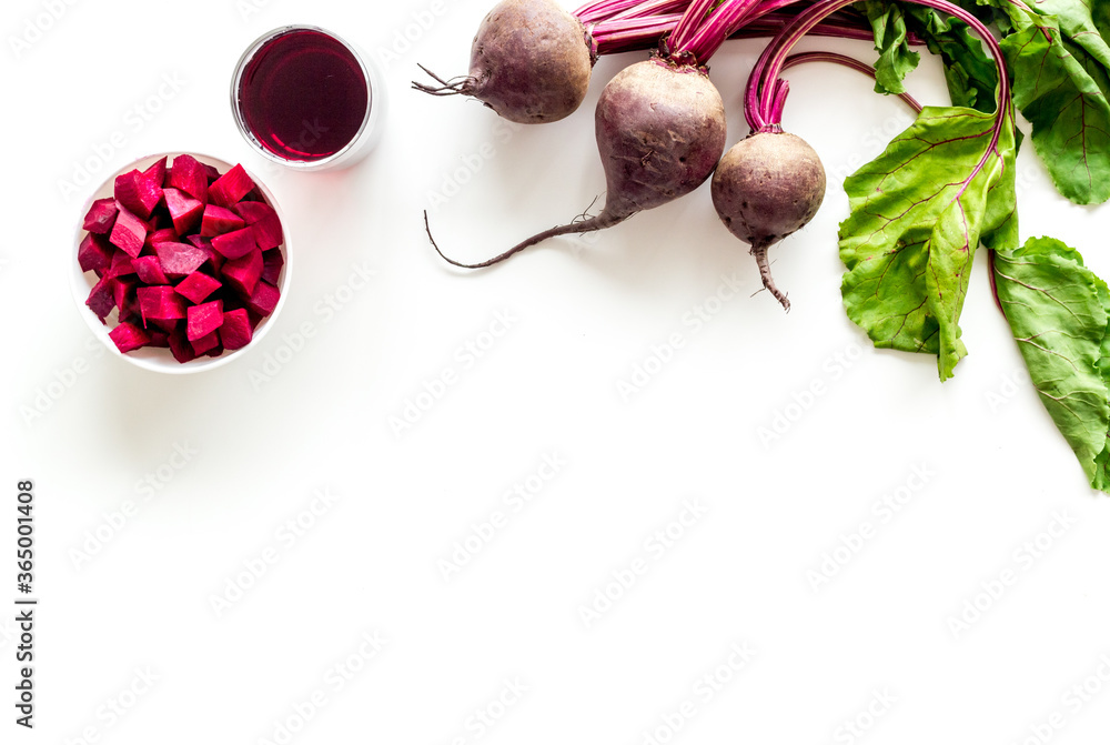 Sliced beet and juice on white table top view copy space