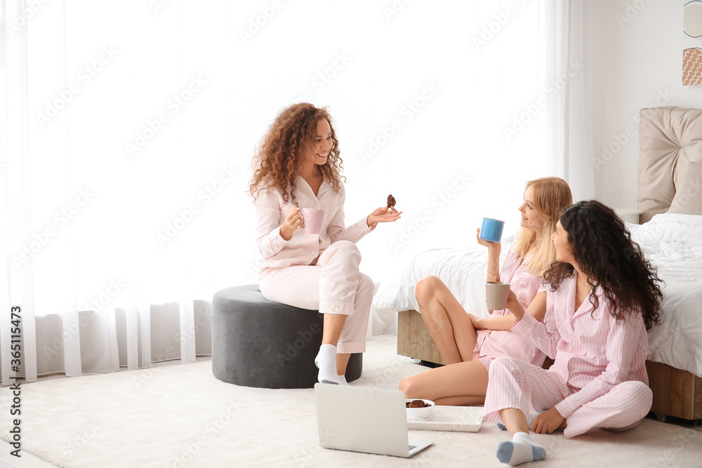 Beautiful young women during pajama party at home