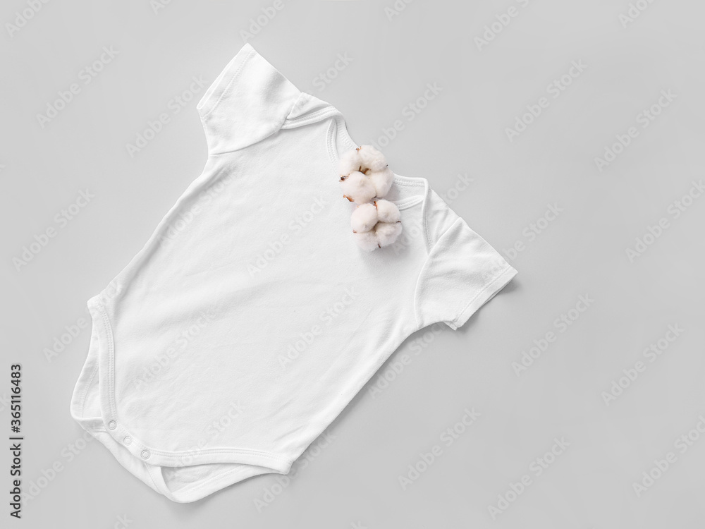 Cotton baby clothes on grey background