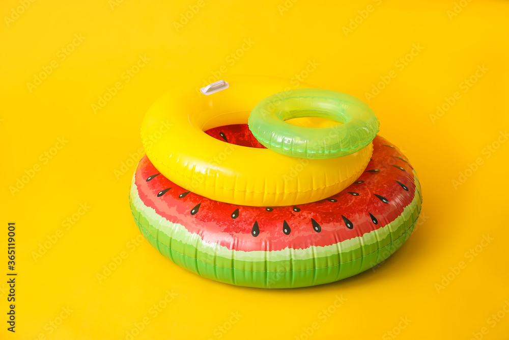 Inflatable rings on color background