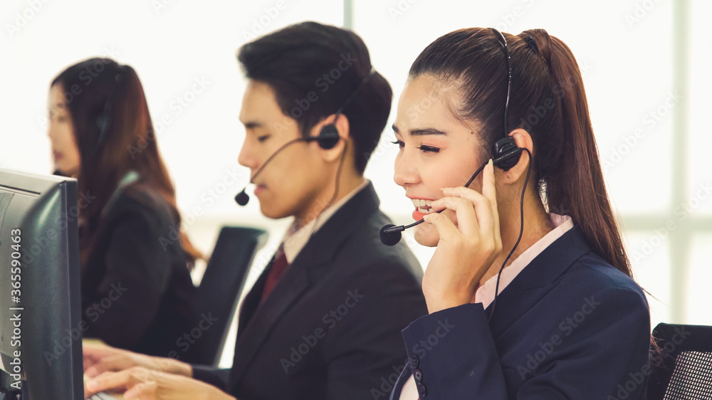 Business people wearing headset working in office to support remote customer or colleague. Call cent