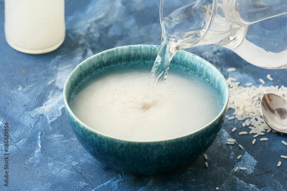 Preparing of rice water on color background