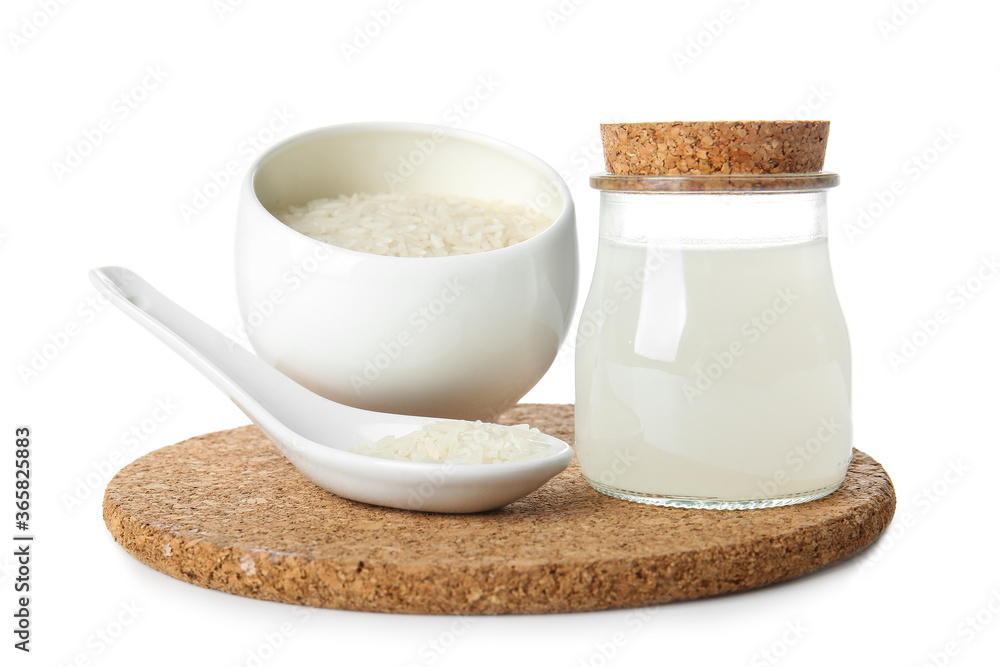 Jar of rice water on white background