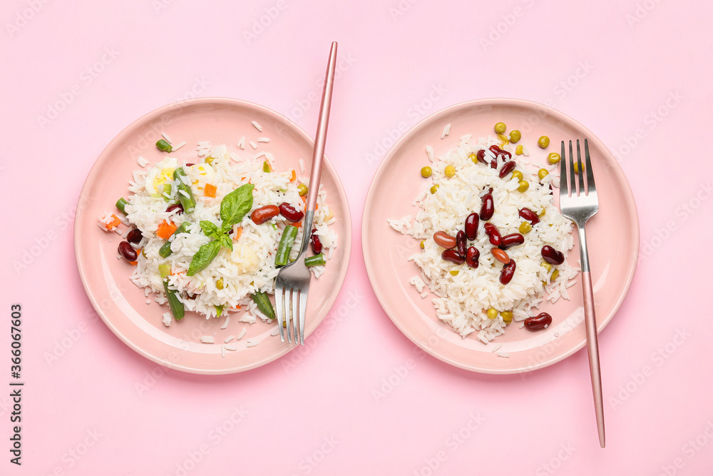 Plates with tasty rice, beans and vegetables on color background