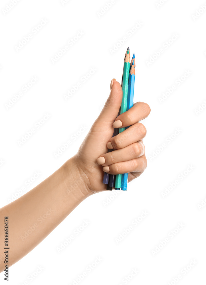 Female hand with pencils on white background