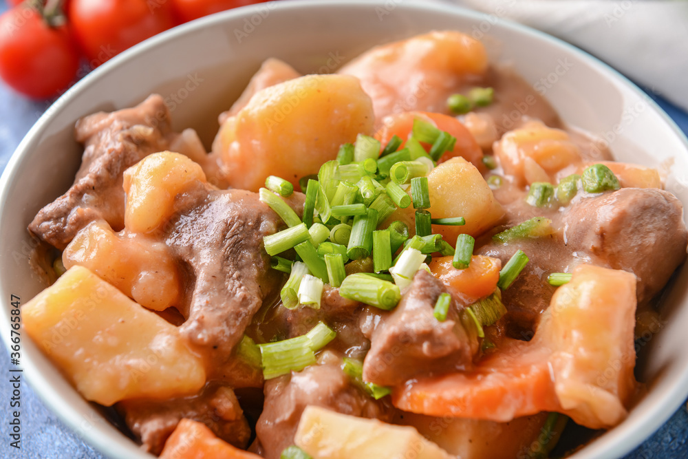 Bowl with tasty beef stew, closeup