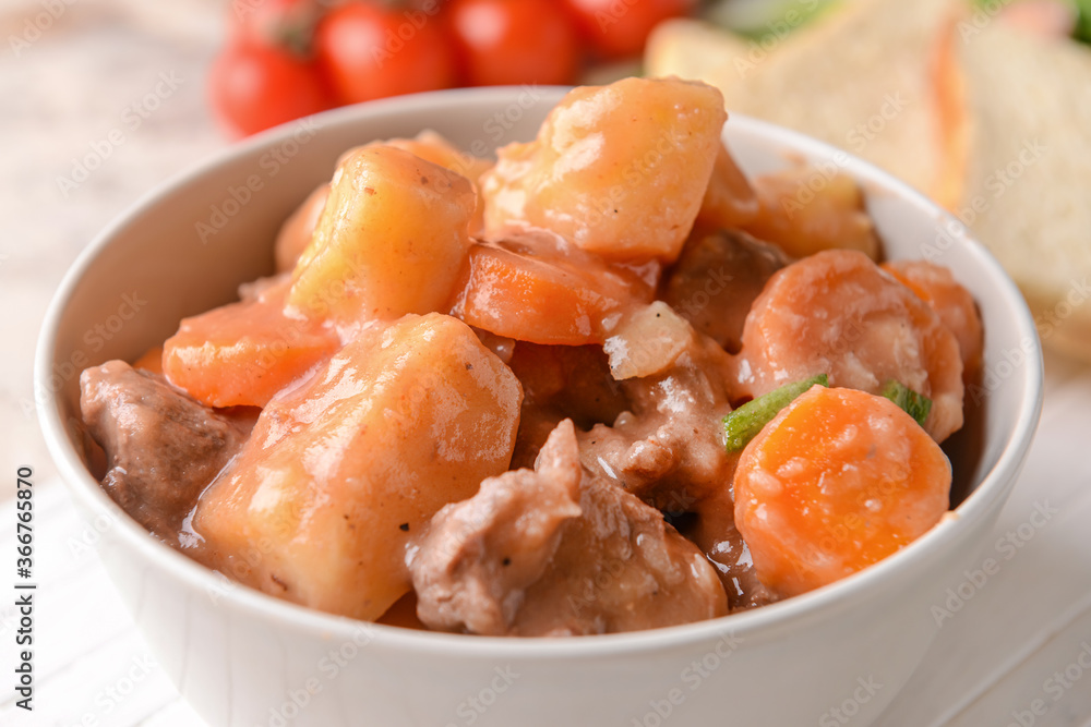 Bowl with tasty beef stew, closeup