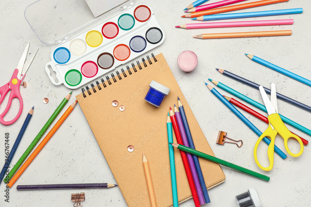 Ordinary pencils with stationery on light background