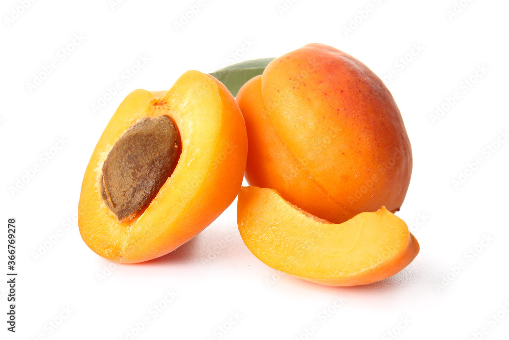 Tasty ripe apricots on white background