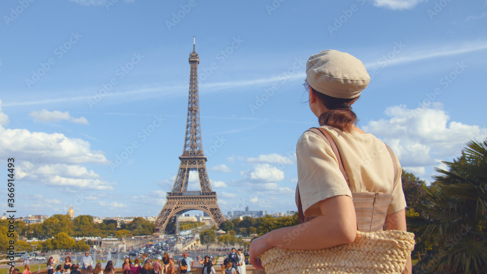 Young tourist at the Eiffel Tower in Paris