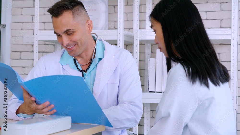 Doctor in professional uniform examining patient at hospital or medical clinic. Health care , medica