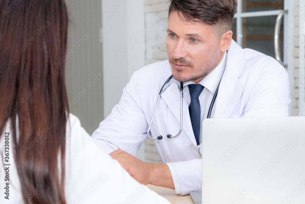 Doctor in professional uniform examining patient at hospital or medical clinic. Health care , medica