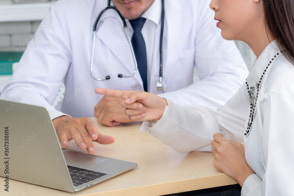 Doctor in professional uniform examining patient at hospital or medical clinic. Health care , medica