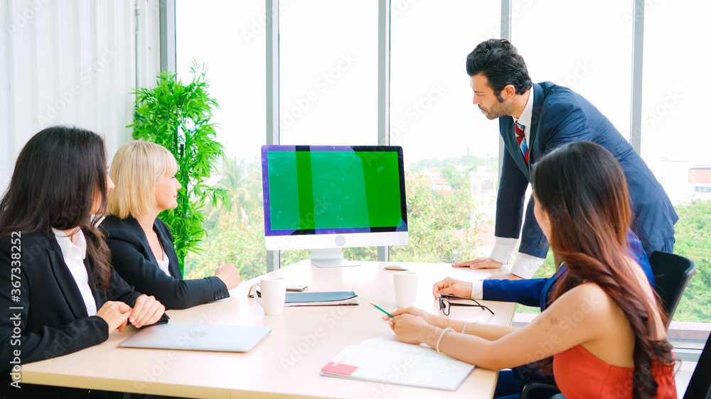 Business people in the conference room with green screen chroma key TV or computer on the office tab