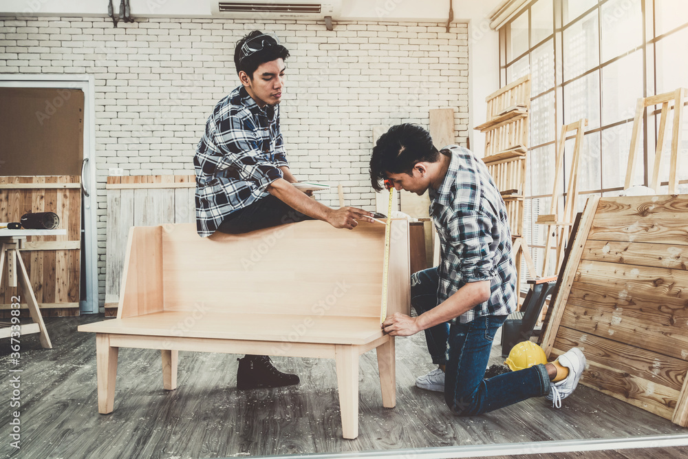 Carpenter working on wood craft at workshop to produce construction material or wooden furniture. Th