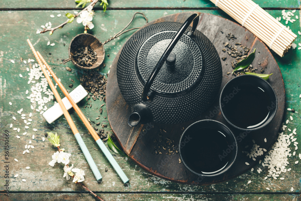 Chinese Tea Set and chopsticks on rustic wooden table