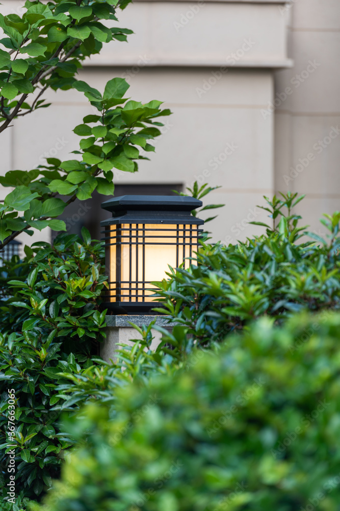 Lighting lamp on the pillar in the villa garden。