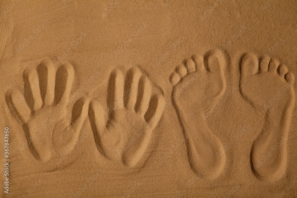 Handprints and Footprints in the Sand