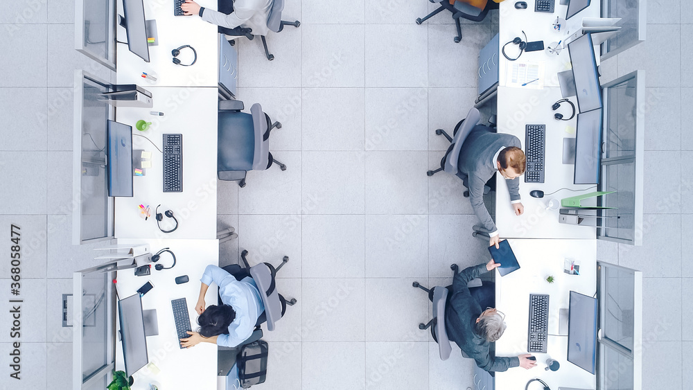 Top Down Shot of Big Busy Corporate Office with Tow Rows off Businessmen and Businesswomen Working o