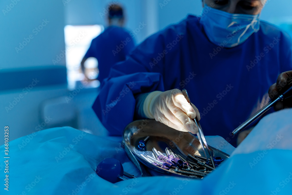 Surgical room in hospital with robotic technology equipment, machine arm surgeon in futuristic opera