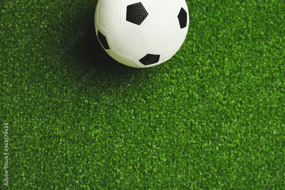 Soccer ball on green field