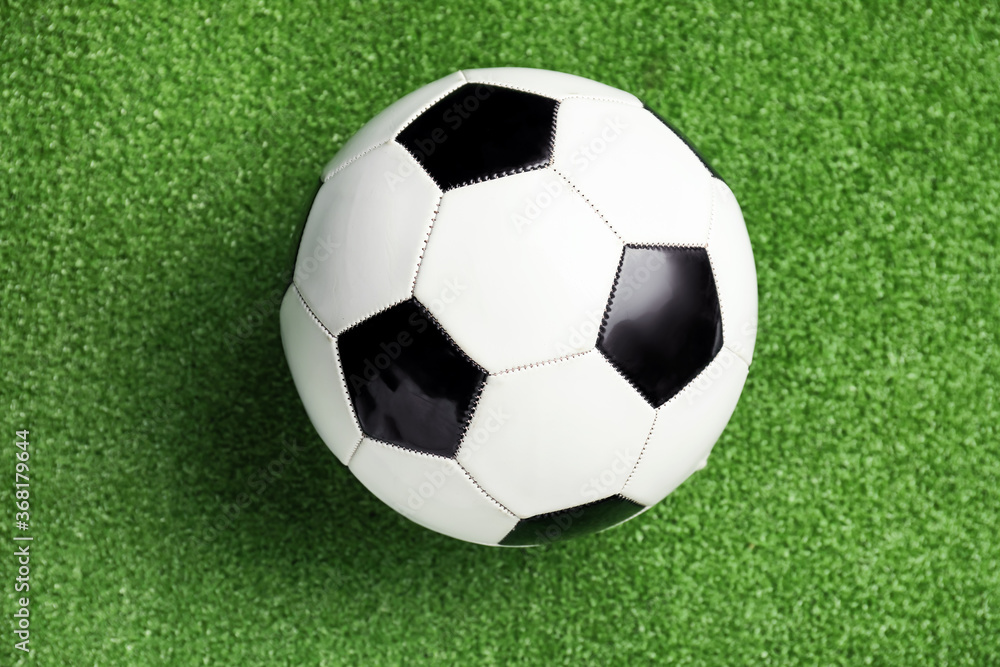 Soccer ball on green field