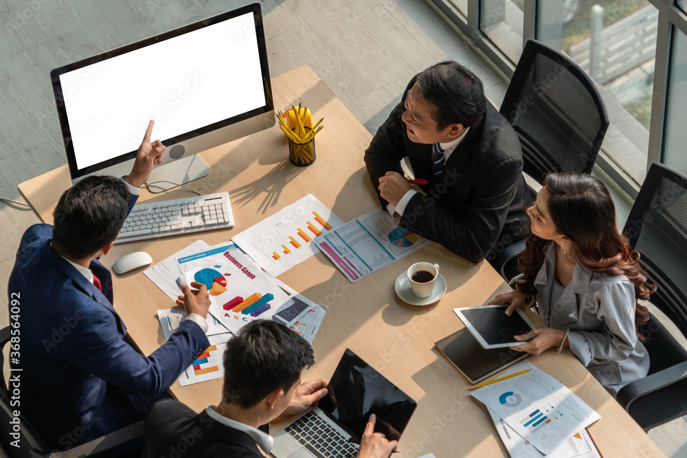 Smart businessman and businesswoman talking discussion in group meeting at office table in a modern 