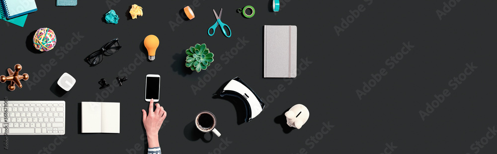 Collection of electronic gadgets and office supplies - flat lay