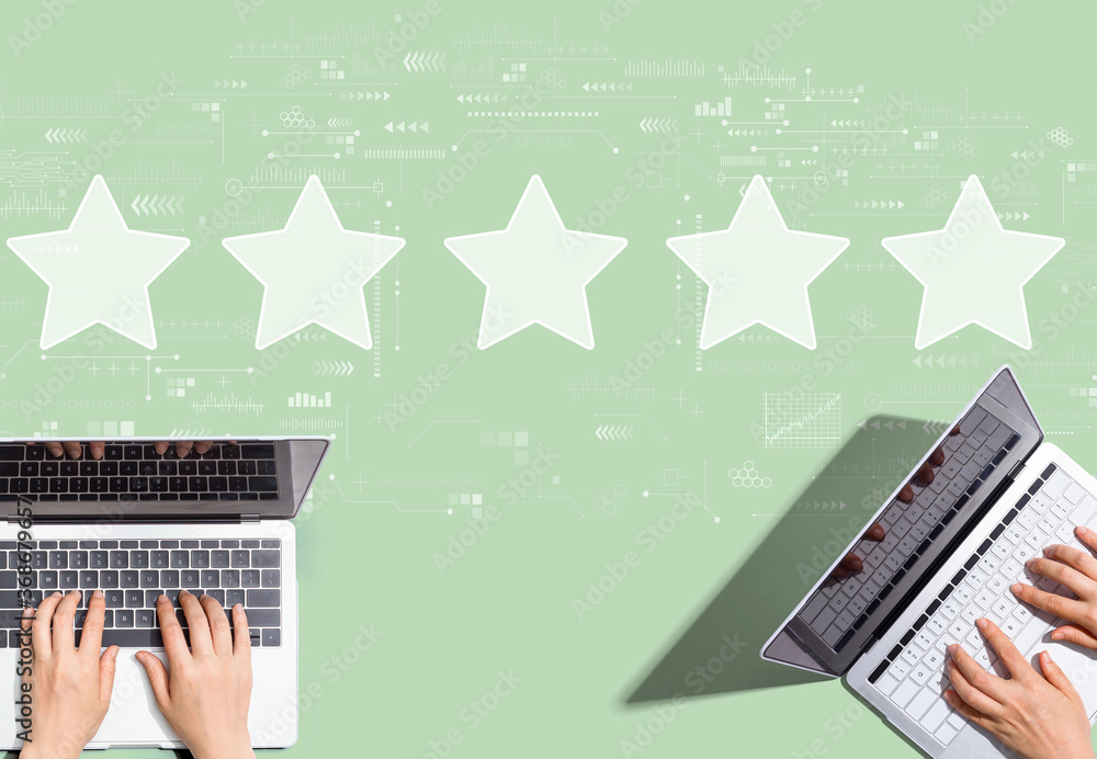 Rating star concept with people working together with laptop computers