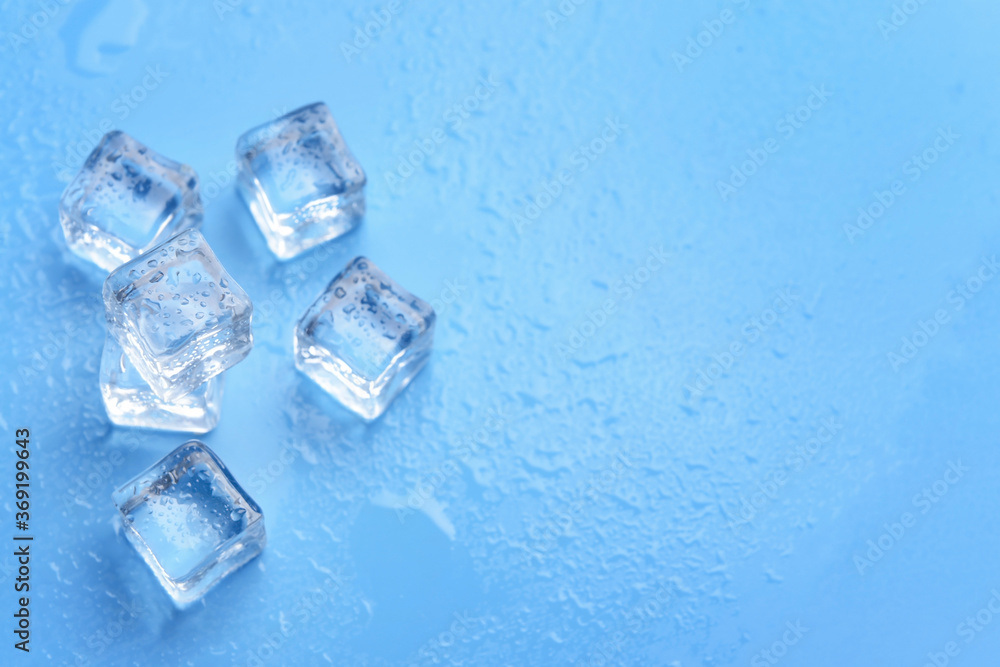 Ice cubes on color background