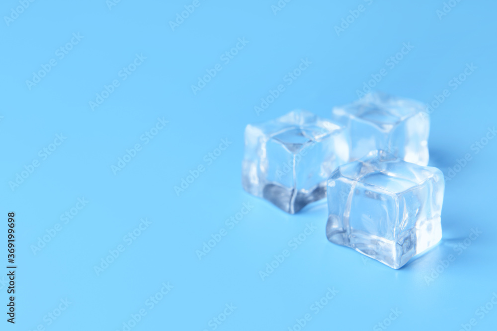 Ice cubes on color background