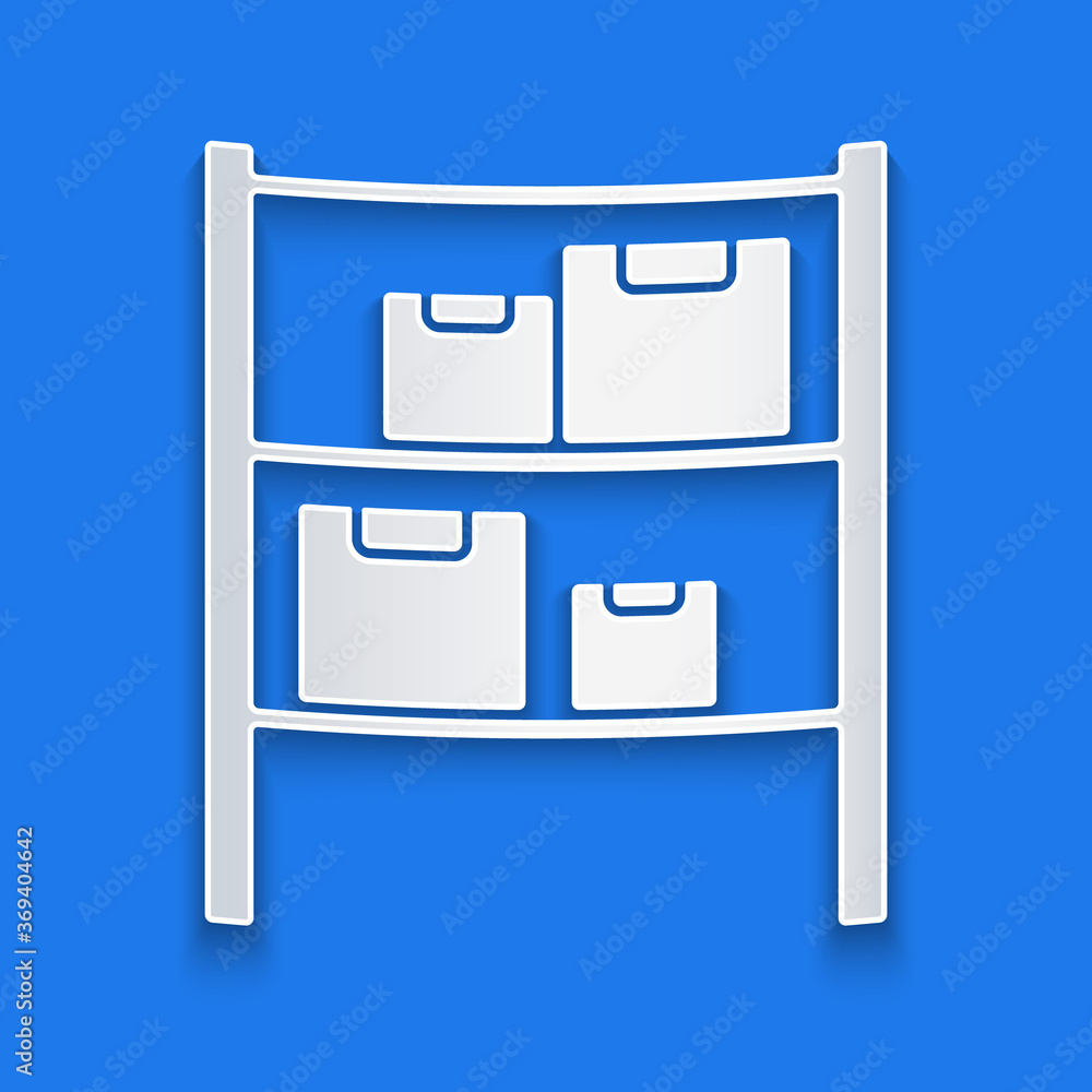 Paper cut Warehouse icon isolated on blue background. Paper art style. Vector Illustration.