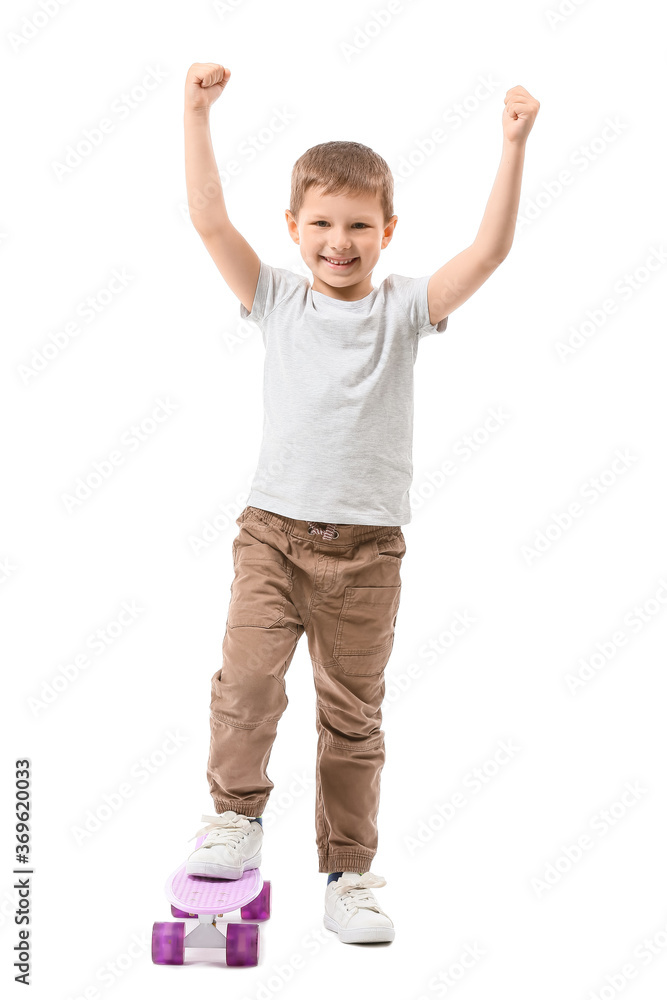 Cute little boy with skateboard on white background