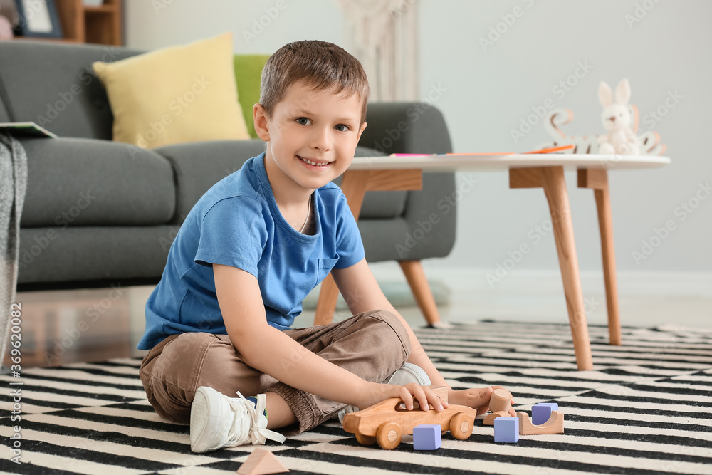 Cute little boy playing at home