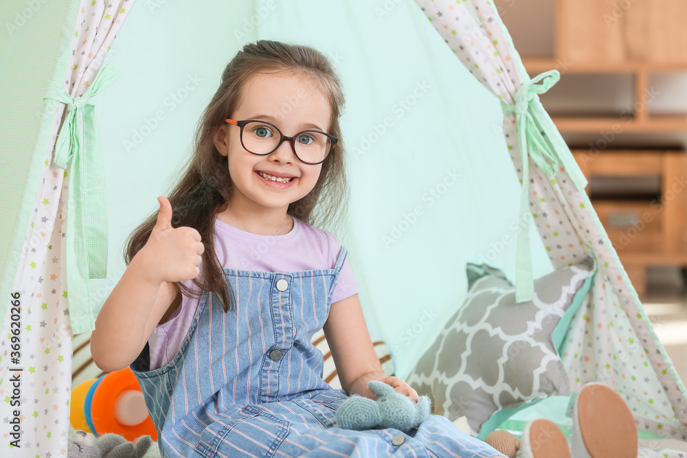 Cute little girl playing at home